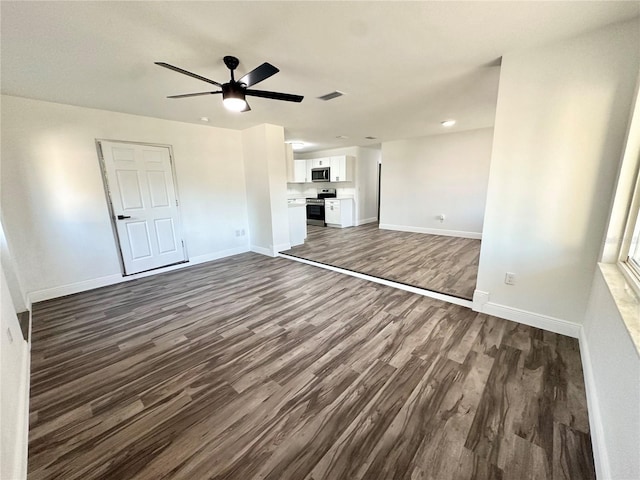 2527 Dons Pl, Lakeland, FL 33801 - unfurnished living room with dark wood-type flooring, baseboards, a ceiling fan, and recessed lighting
