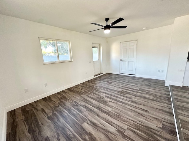 2527 Dons Pl, Lakeland, FL 33801 - unfurnished bedroom with dark wood-type flooring, baseboards, and a ceiling fan