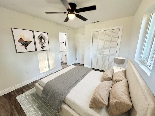 2527 Dons Pl, Lakeland, FL 33801 - bedroom featuring wood finished floors, baseboards, a closet, ceiling fan, and ensuite bath