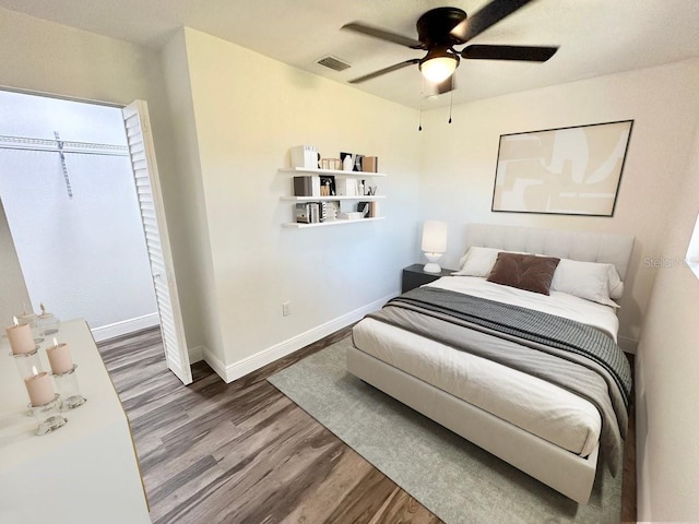 2527 Dons Pl, Lakeland, FL 33801 - bedroom featuring wood finished floors, baseboards, and ceiling fan