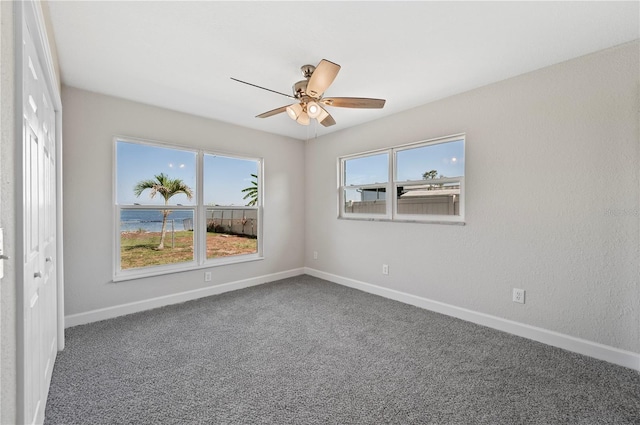 1502 Edgewater Beach Dr, Lakeland, FL 33805 - unfurnished room with carpet flooring, baseboards, and a ceiling fan