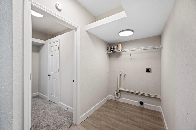 1502 Edgewater Beach Dr, Lakeland, FL 33805 - clothes washing area featuring laundry area, electric dryer hookup, a skylight, wood finished floors, and baseboards