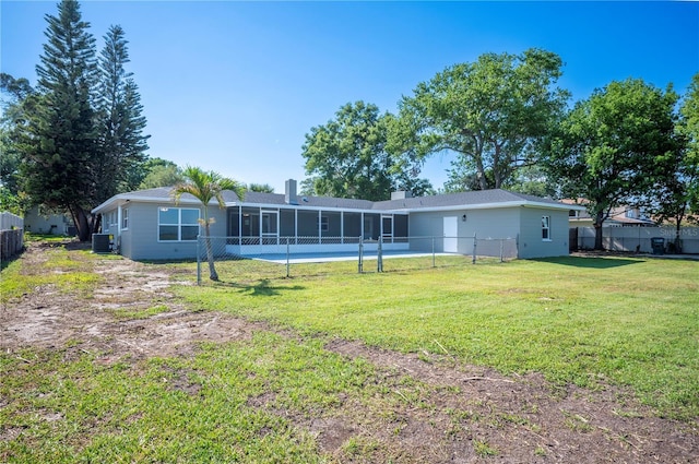 1502 Edgewater Beach Dr, Lakeland, FL 33805 - back of house featuring a yard, fence, central AC unit, and a sunroom