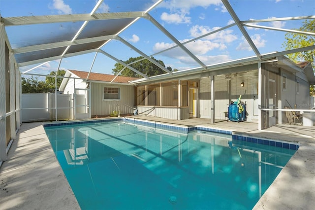 view of pool featuring a patio area, fence, a fenced in pool, and a lanai