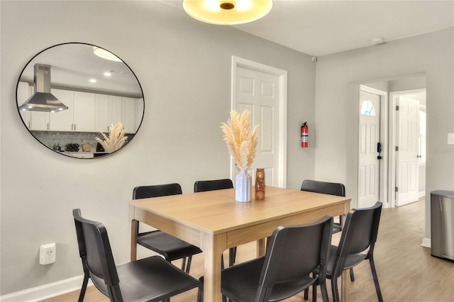 13032 Cumberland Dr, Largo, FL 33773 - dining area with light wood finished floors and baseboards