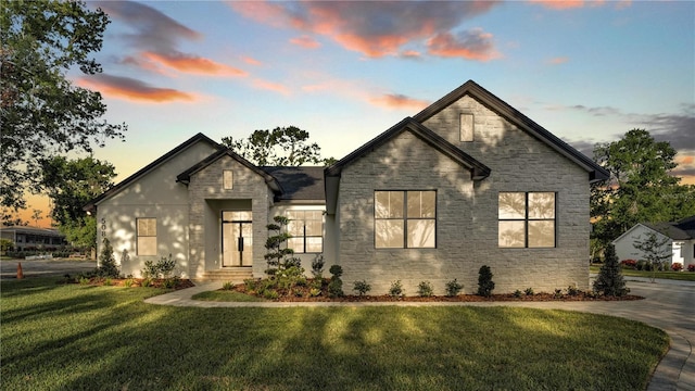 5087 Cliffside Dr, Lakeland, FL 33813 - view of front of property featuring stone siding and a front yard