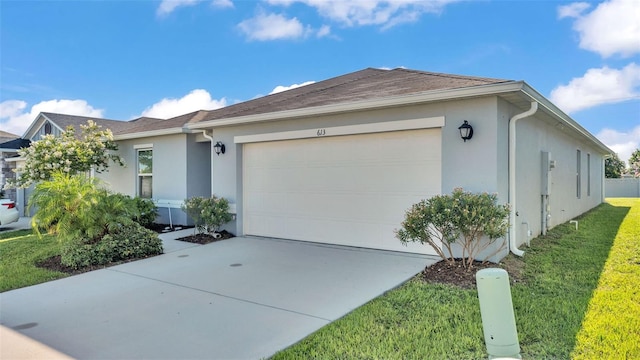 613 Sarner Pass Way, Winter Haven, FL 33881 - view of front of home with stucco siding, a garage, driveway, and a front yard