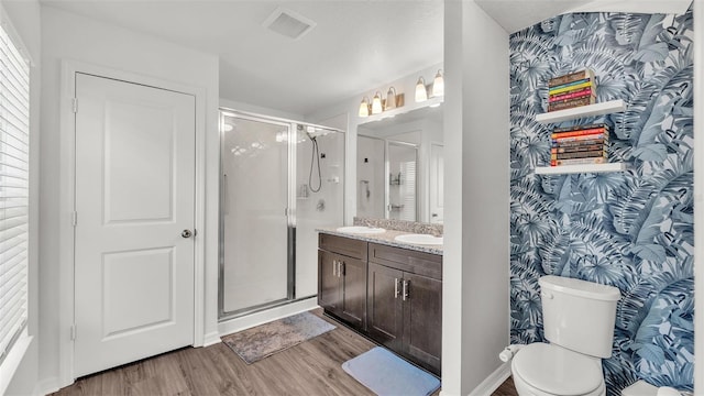 613 Sarner Pass Way, Winter Haven, FL 33881 - full bath with wood finished floors, vanity, and a shower stall