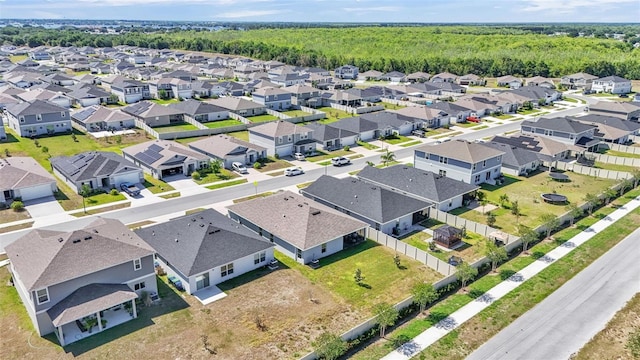 613 Sarner Pass Way, Winter Haven, FL 33881 - aerial perspective of suburban area with a forest