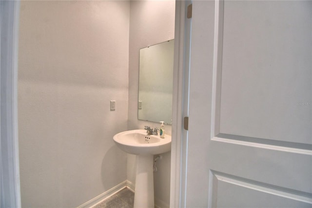 bathroom with baseboards