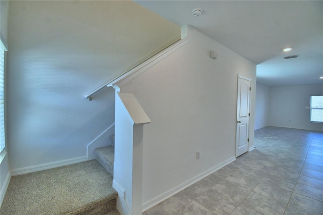 stairs with baseboards, visible vents, and recessed lighting