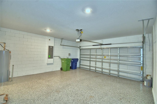 garage featuring concrete block wall, water heater, a garage door opener, and electric panel