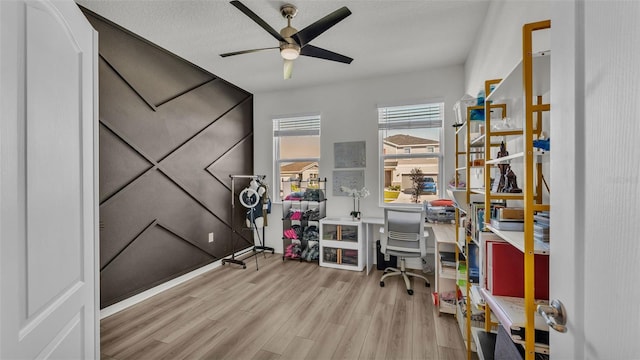 office area with wood finished floors and ceiling fan