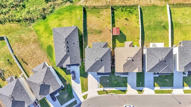 birds eye view of property with a residential view