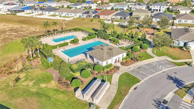 birds eye view of property with a residential view