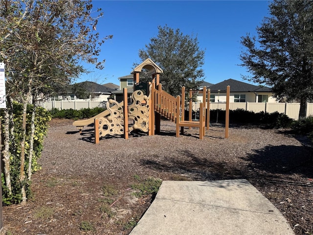 community jungle gym featuring fence