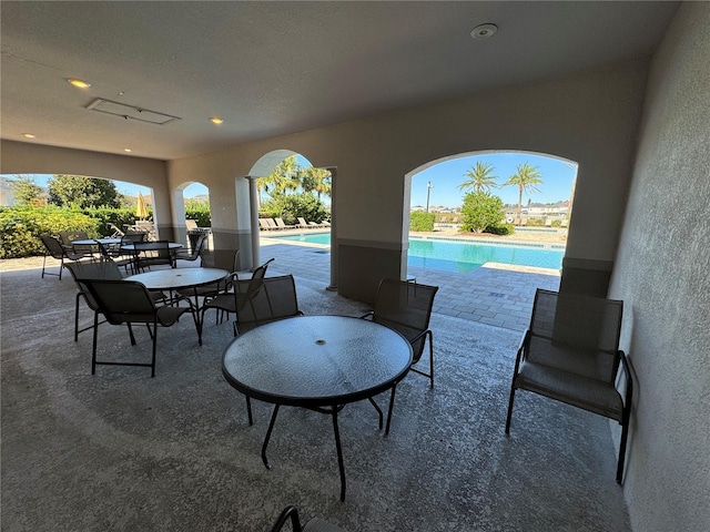 view of patio featuring an outdoor pool