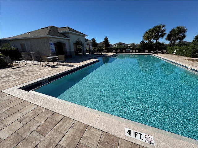 community pool with a patio
