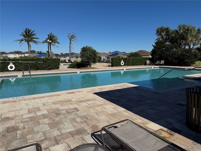 pool with a patio area