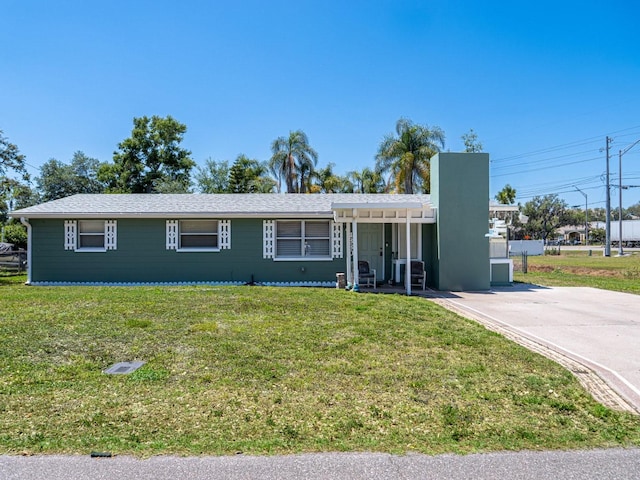 4830 Melody Ln, Lakeland, FL 33805 - ranch-style house featuring concrete driveway and a front yard