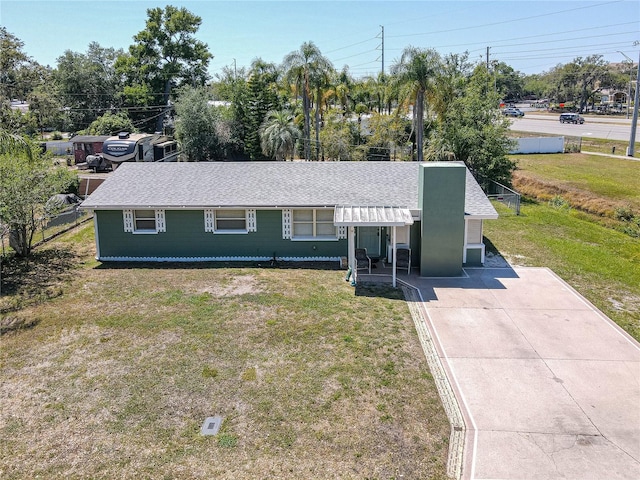 4830 Melody Ln, Lakeland, FL 33805 - single story home featuring driveway, a shingled roof, and a front lawn