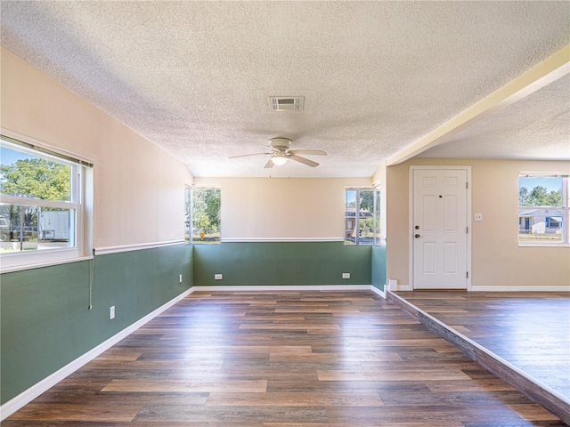 4830 Melody Ln, Lakeland, FL 33805 - spare room featuring wood finished floors, visible vents, a textured ceiling, and ceiling fan