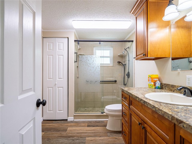 4830 Melody Ln, Lakeland, FL 33805 - bathroom with a shower stall, toilet, ornamental molding, and vanity