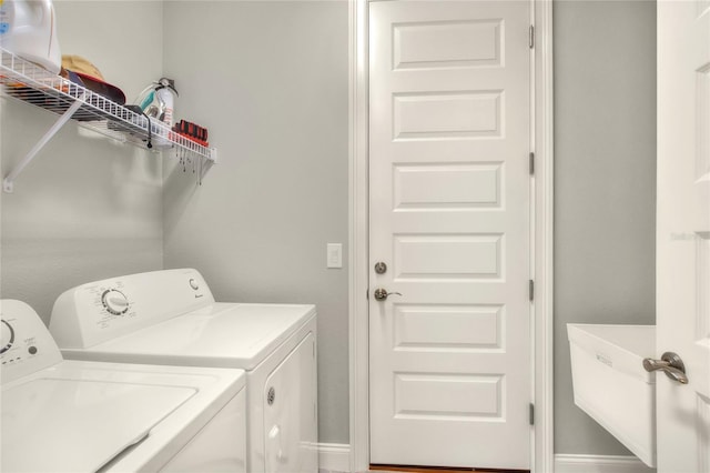 7779 Lake James Blvd, Lakeland, FL 33810 - laundry room featuring separate washer and dryer