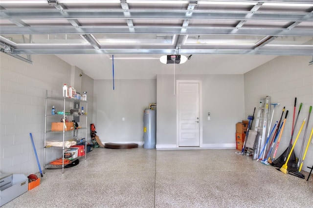7779 Lake James Blvd, Lakeland, FL 33810 - garage featuring water heater, concrete block wall, and a garage door opener