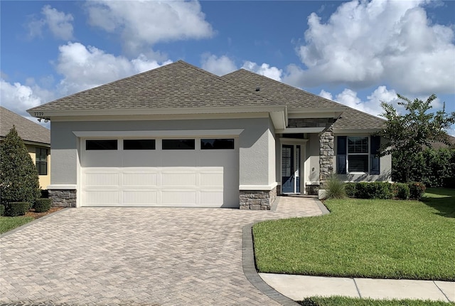 7779 Lake James Blvd, Lakeland, FL 33810 - view of front facade featuring stone siding, decorative driveway, and stucco siding