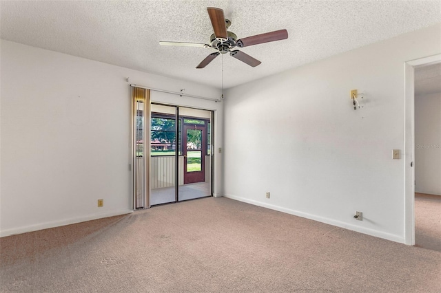 carpeted empty room with baseboards, a textured ceiling, and ceiling fan