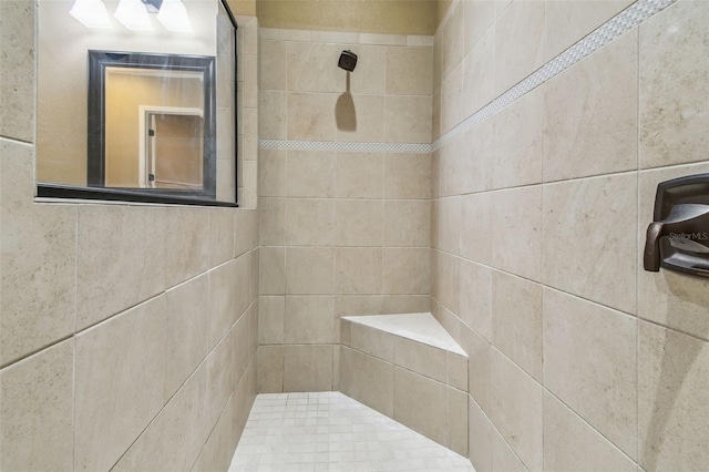 bathroom featuring tiled shower