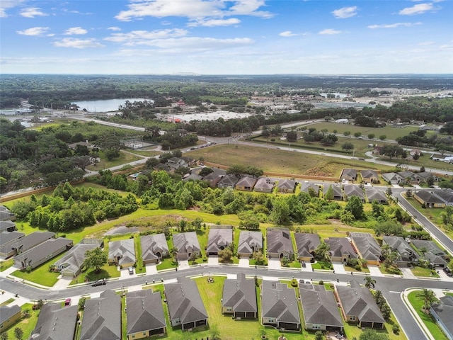 bird's eye view featuring a residential view and a water view
