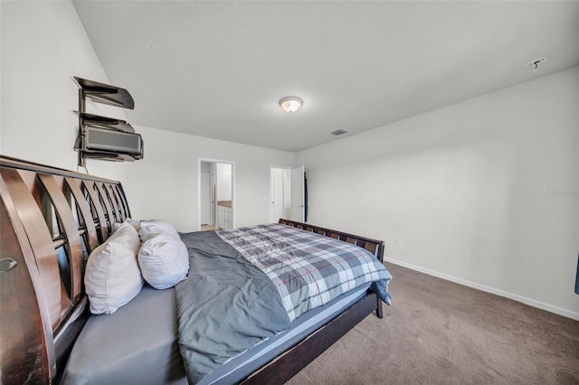 bedroom with carpet floors, visible vents, and baseboards