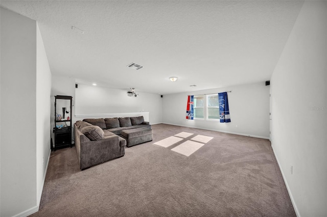 carpeted living area featuring a textured ceiling, visible vents, and baseboards