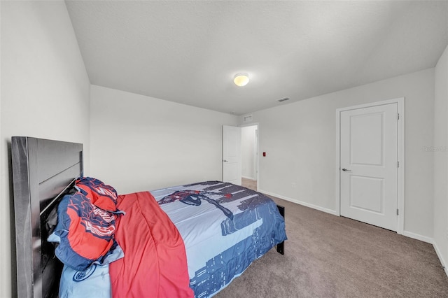 bedroom with visible vents, carpet flooring, and baseboards
