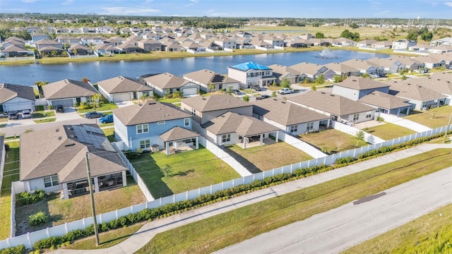 bird's eye view featuring a residential view and a water view