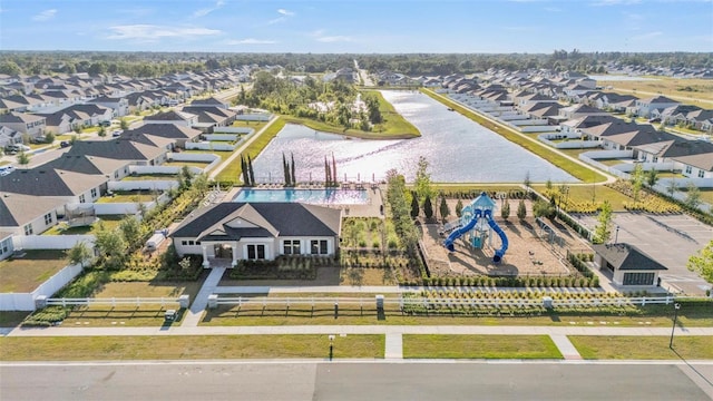 birds eye view of property with a residential view and a water view