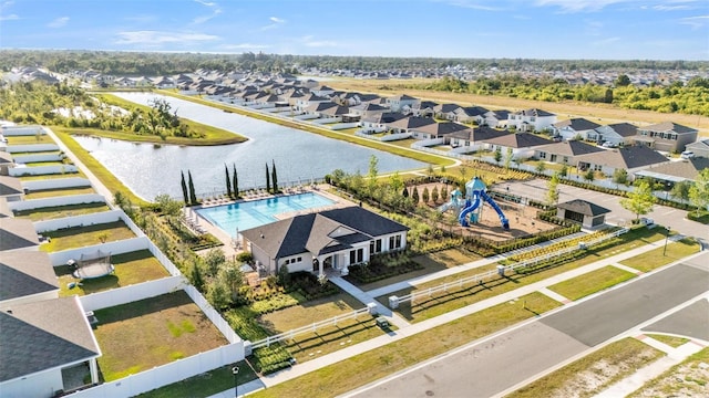 bird's eye view featuring a residential view and a water view