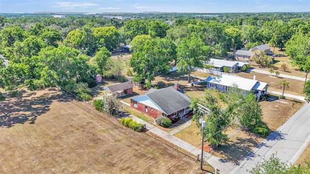 birds eye view of property with a wooded view