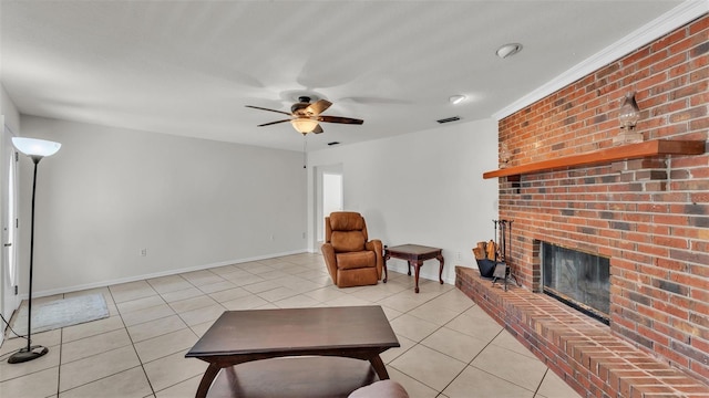 living room featuring light tile patterned floors, ceiling fan, baseboards, a brick fireplace, and visible vents