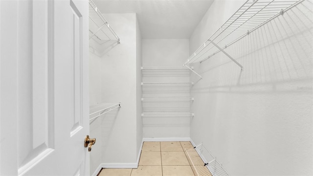 walk in closet featuring tile patterned floors