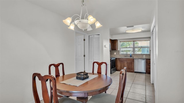 dining area with visible vents, a notable chandelier, and light tile patterned flooring