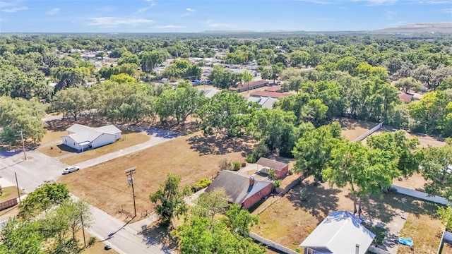 bird's eye view featuring a wooded view