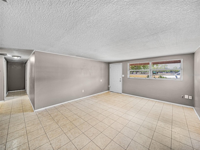 1720 Kendrick Ln, Lakeland, FL 33805 - tiled spare room with a textured ceiling and baseboards