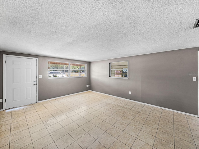 1720 Kendrick Ln, Lakeland, FL 33805 - interior space with tile patterned flooring and a textured ceiling