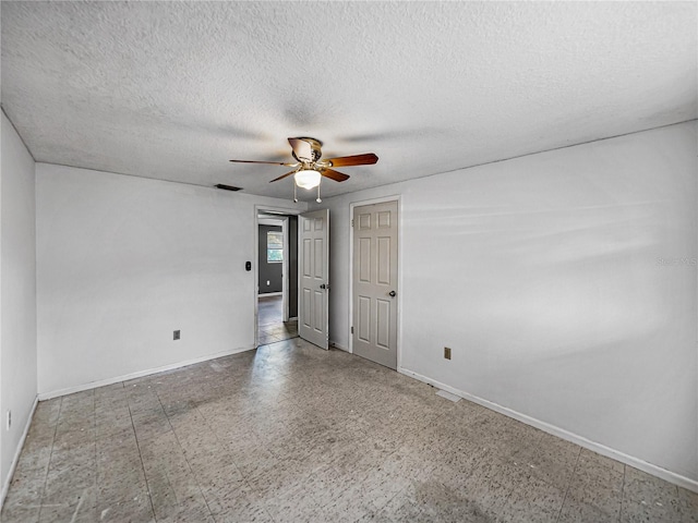 1720 Kendrick Ln, Lakeland, FL 33805 - unfurnished room with a ceiling fan, visible vents, a textured ceiling, and baseboards