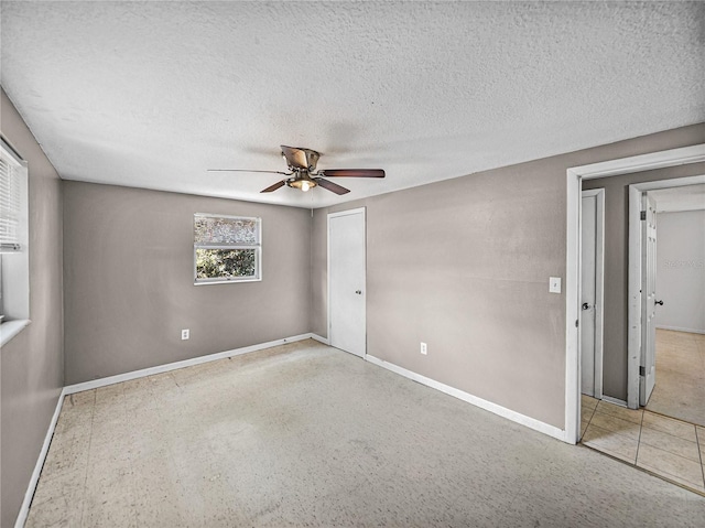 1720 Kendrick Ln, Lakeland, FL 33805 - spare room featuring baseboards, ceiling fan, and a textured ceiling