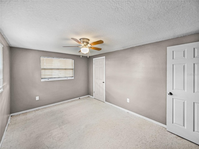 1720 Kendrick Ln, Lakeland, FL 33805 - unfurnished bedroom featuring a textured ceiling, a ceiling fan, and baseboards