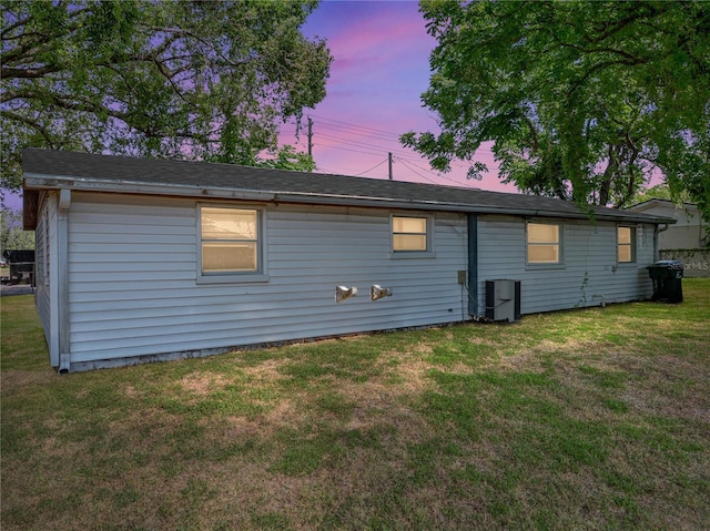 1720 Kendrick Ln, Lakeland, FL 33805 - back of property with a yard and central air condition unit